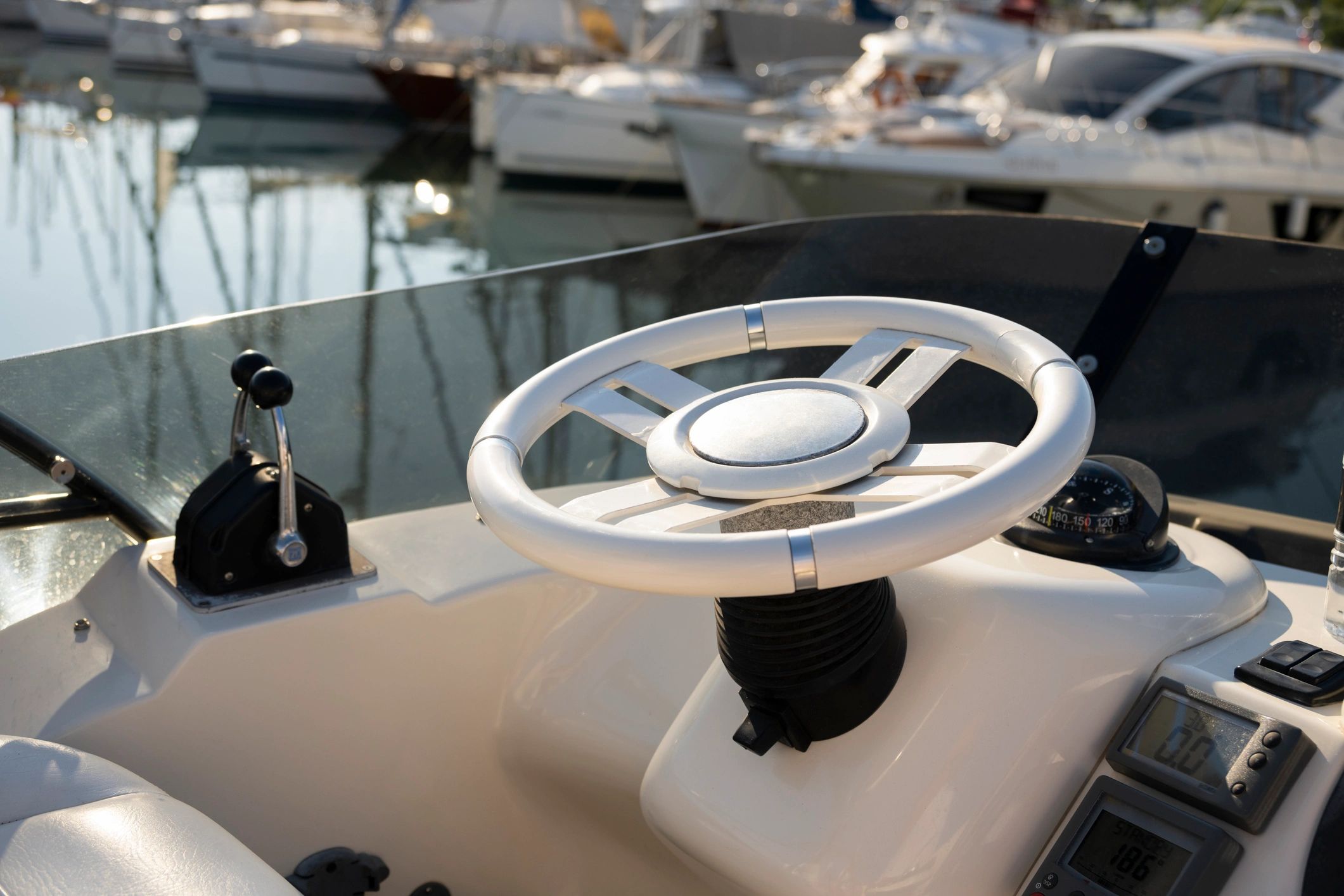 Sailboat wheel with ocean background