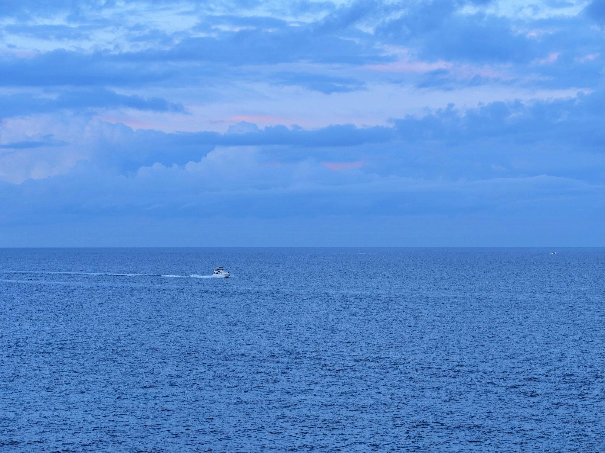 Boat cruising across open ocean
